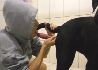 Hoodie-wearing fucker puts dog dick in that mouth