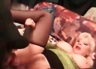 Big-breasted whore enjoys hot sex with a dog